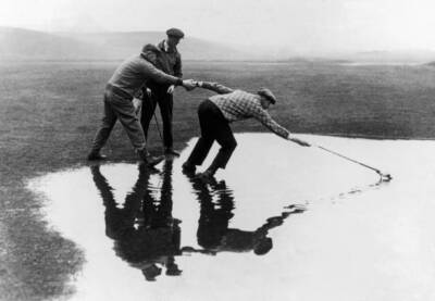 Some golfers trying catch ball a puddle scotland november 22 1933 Old Photo