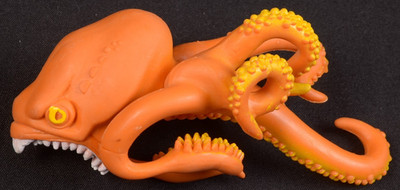 Dave and Busters Monster Isle Kraken  RUBBER toy Orange Octopus