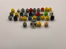 Lego minifigure heads lot of thirty four. Assorted color and faces. 