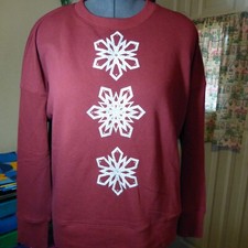 Red sweatshirt for women with three glitter snowflakes and rhinstones.
