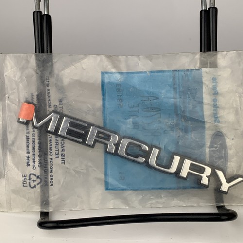 NOS 1986 - 1989 Mercury Topaz Grill Emblem Mercury E66Y-8C270-A NIP - Picture 2 of 2