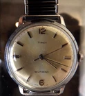 TIMEX  MENS  1968 SILVER DIAL  AUTOMATIC WIND 34MM NOS STRETCH STRAP