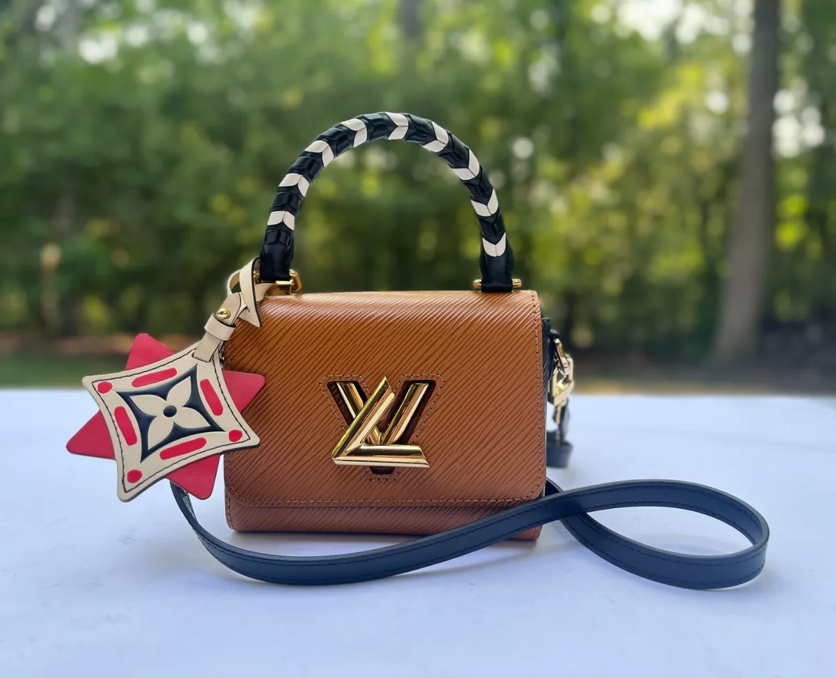 Twist: LV Brand Mark Twist Lock Handbags