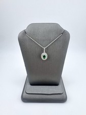 14k White Gold Necklace With A Round/Baguette Diamond Along With Emerald Pendent