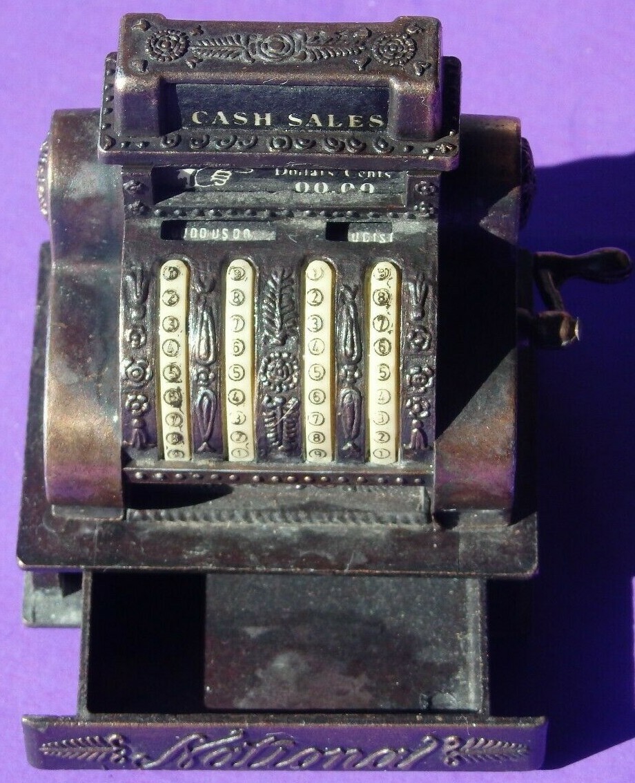 как выглядит VINTAGE METAL DIECAST 2" NATIONAL CASH REGISTER - SOME AGING, NO REAL DAMAGE фото