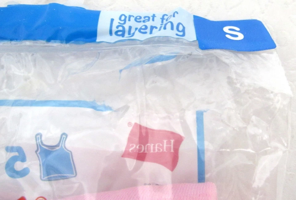 Pack de 3 camisetas sin mangas Hanes Camis para niña talla pequeña (6) blancas, grises y rosas Foto 3 de 4