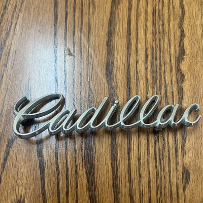 1970's Cadillac Emblem Logo Badge Nameplate Script OEM GM Part Number 1607891