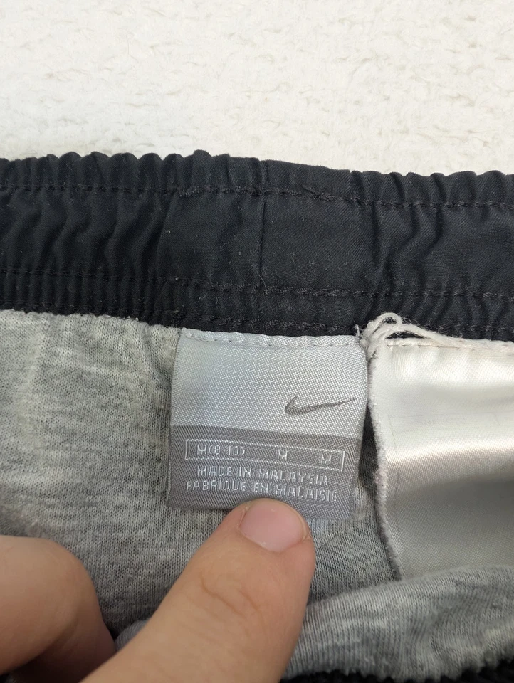 Pantalones cortavientos Nike para hombre M 31x30 negros Y2K algodón forrado cordón Foto 2 de 4