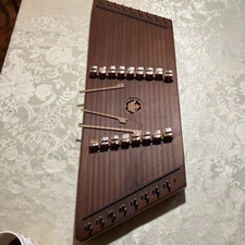Vintage Dusty Strings hammered dulcimer with hammers.