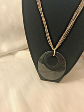 DAISY FUENTES SILVER TONE MULTI CHAIN NECKLACE WITH BLACK CIRCLE PENDANT