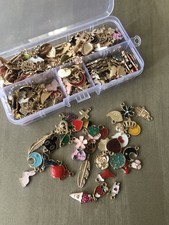 Large bundle of curated charms for jewelry making in case