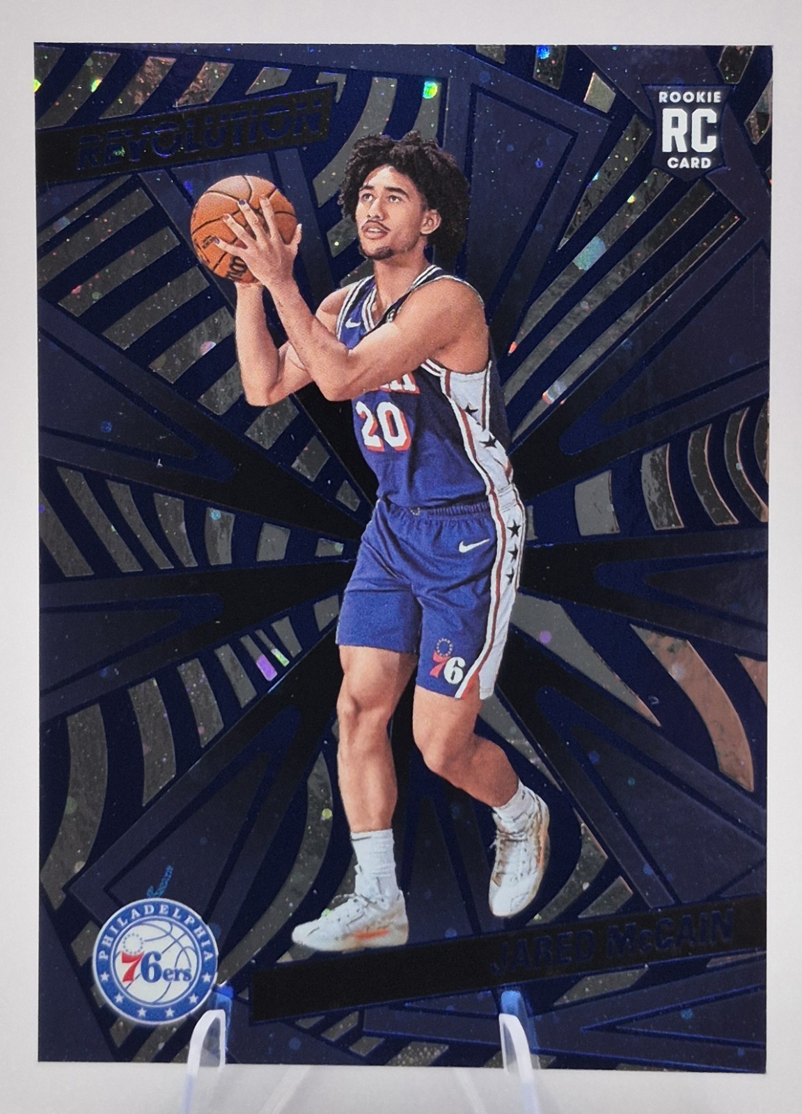 2024-25 Panini Revolution Rookies Jared McCain #124 Blue Cosmo /285 (RC)