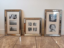 next set of three mirrored glass multiple aperture photo frames wall hanging