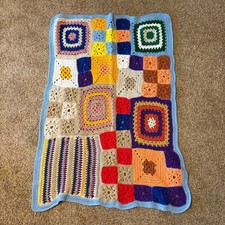 Vintage boho gender neutral colorful knitted crochet baby blanket