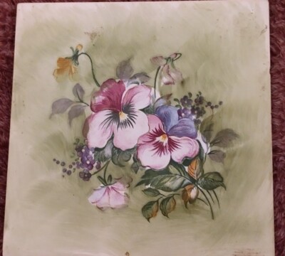 vintage porcelain ceramic tile with pansies on it