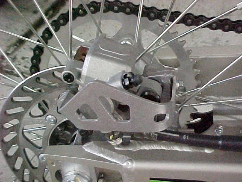 Works Connection - 25-020 - Aluminum Rear Brake Caliper Guard - Made In USA