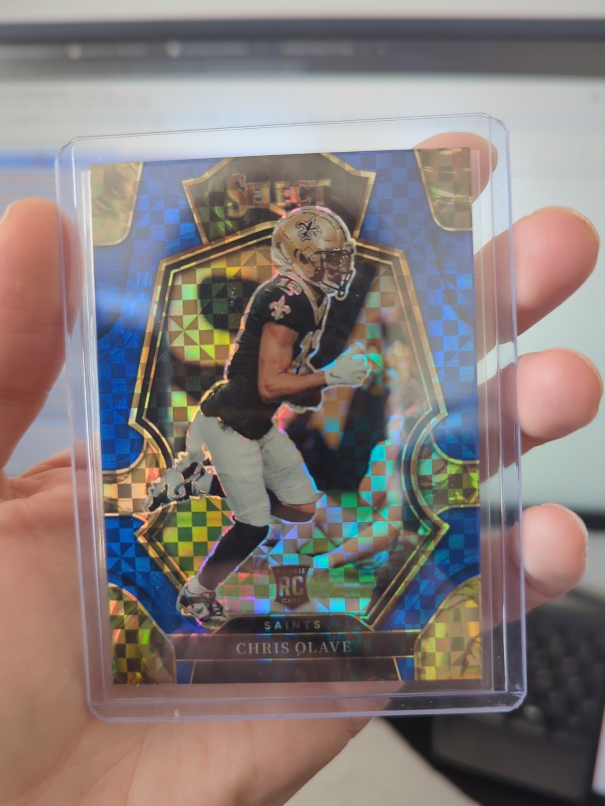 2022 Panini Select - Premier Level Chris Olave #170 Blue Prizm /149 (RC)