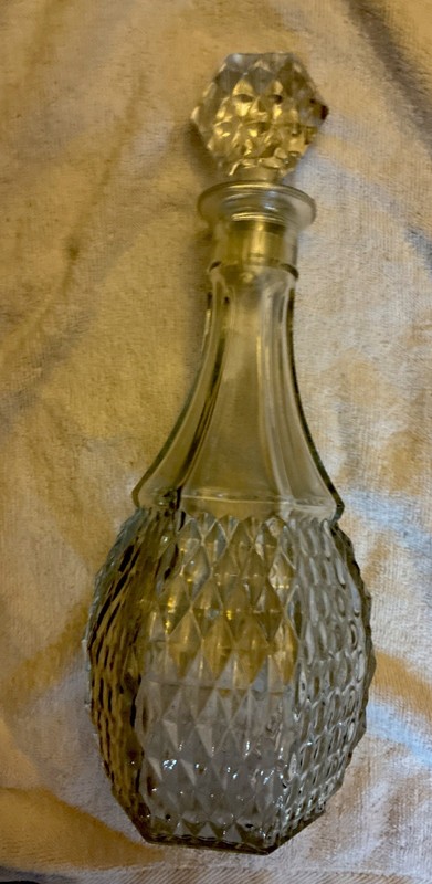 A Vintage Clear Glass Diamond Cut Decanter. Has A Studded Diamond Pattern.