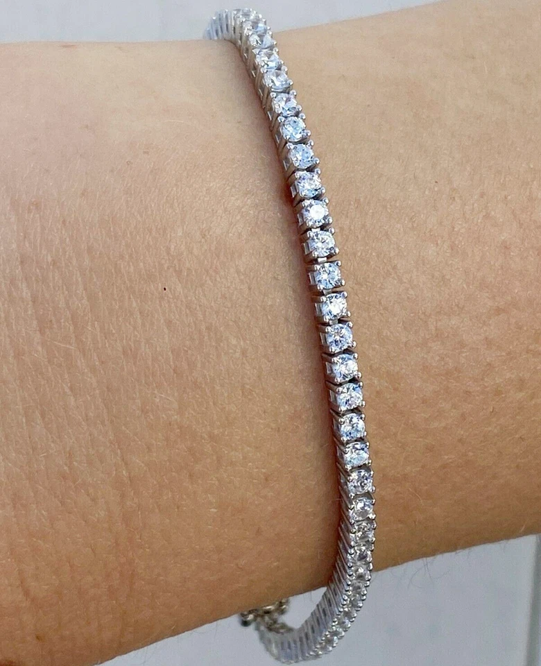 Pulsera de tenis moissanita de corte redondo de 2,0 mm enchapada en oro blanco 14k Foto 2 de 4