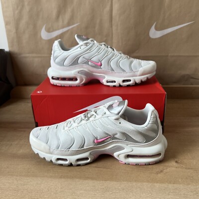 pink and white nike tns
