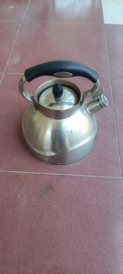 Clean stainless steel whistling tea kettle. Good condition