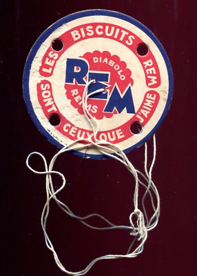 old advertising. old game ''here's the grinder'' a REM BISCUIT at snack