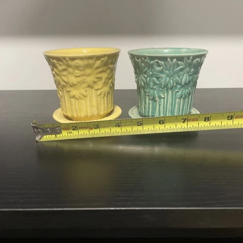 A pair (2) of vintage McCoy Pottery Daisy planters with attached saucers. A+