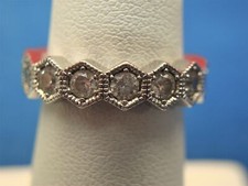 STERLING SILVER SURROUNDED BY STONES BAND RING - SHARP
