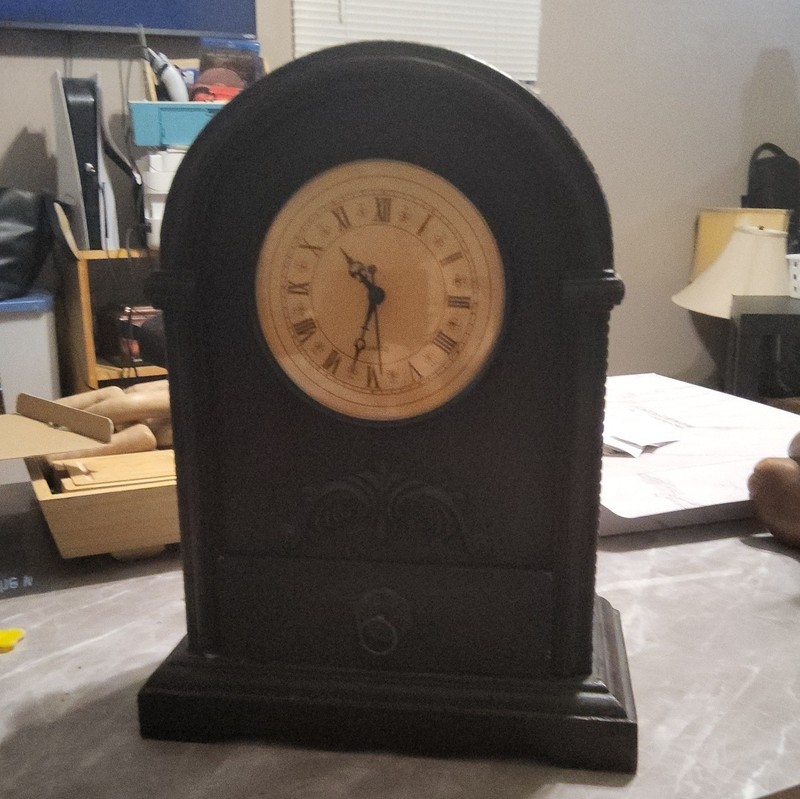 Black Arched Mantel Clock with Analog Display and Roman Numeral Dial Face