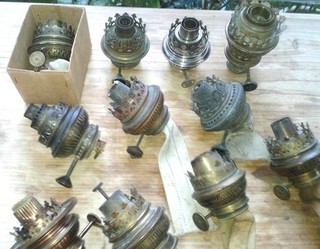 Many old large burners for kerosene lamps