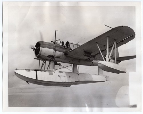 1943 Coast Guard Vought OS2U Kingfisher Dropping Food Bomb to Raft News Photo