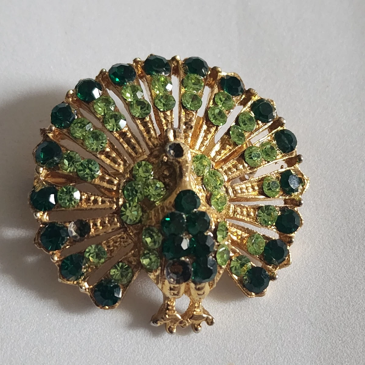 Vintage emerald best sale brooch