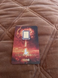 Carded Chernobyl .9999 fine 1/1000 ounce gold bar. Limited mintage. 897/9999..