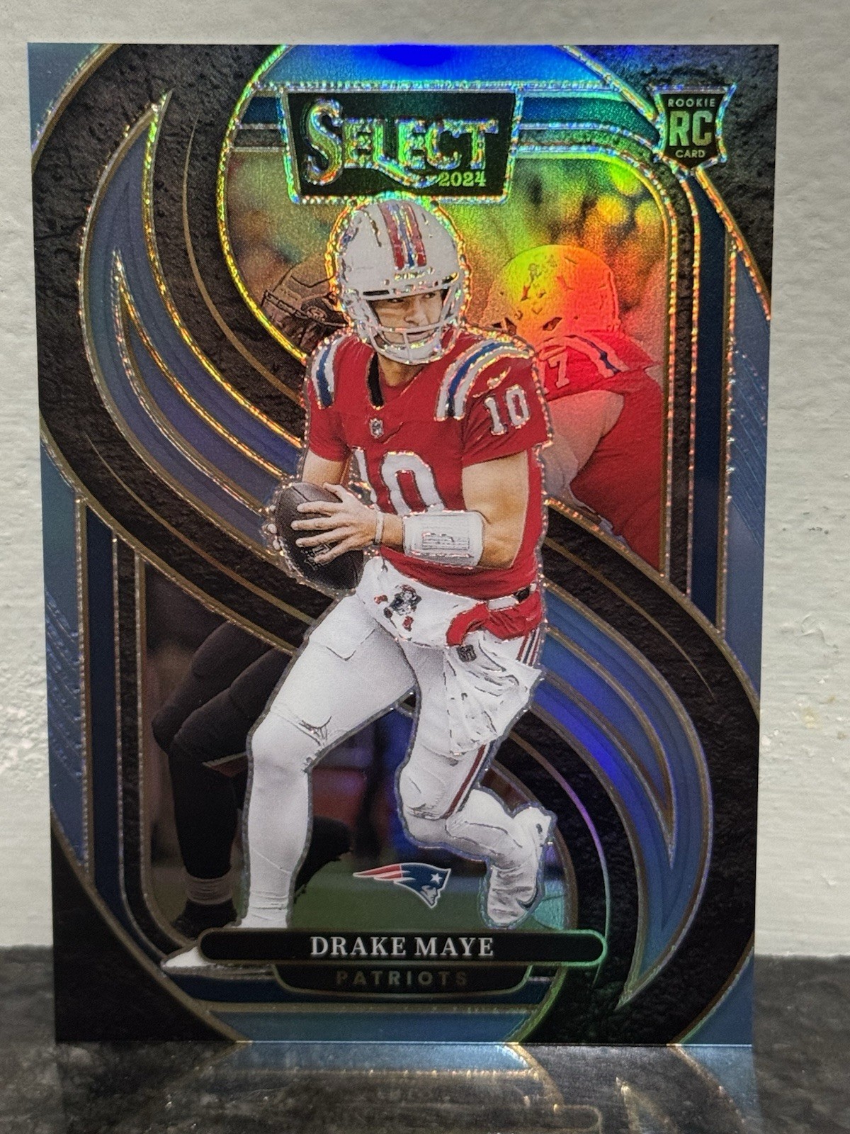 Drake Maye 2024 Panini Select Rookie Light Blue Prizm Premier Level RC 12/99