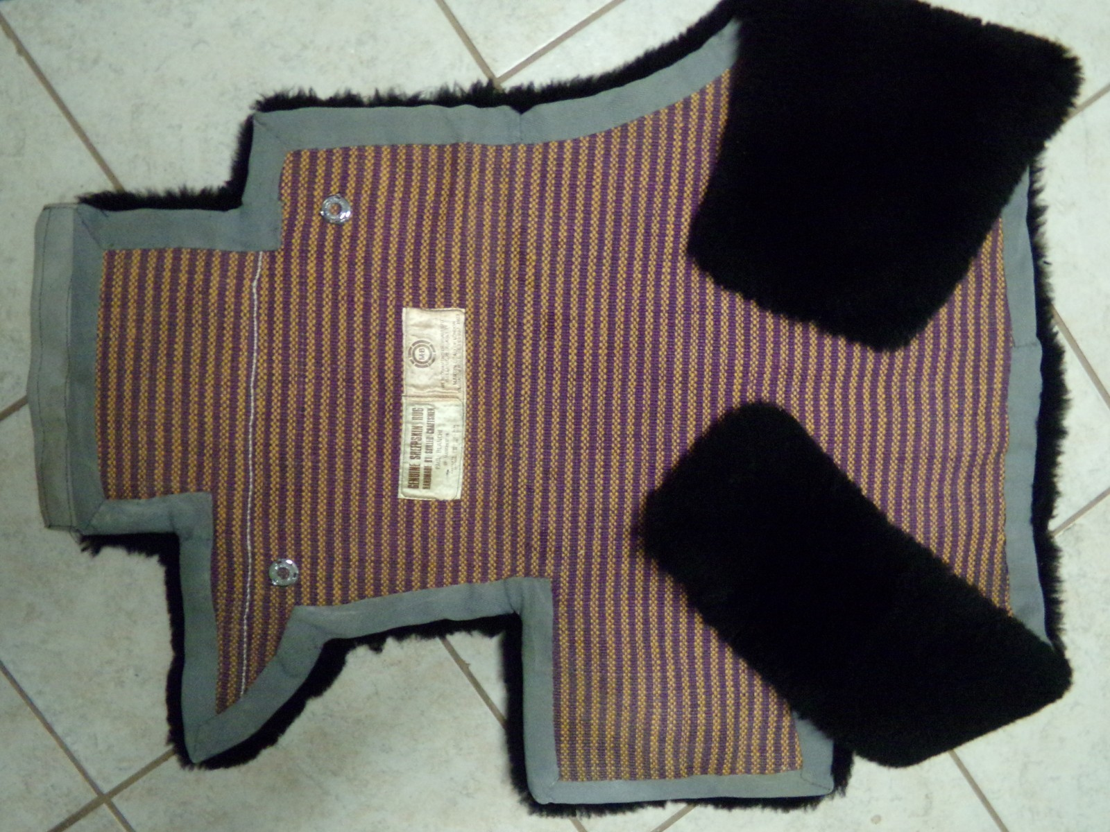 A SET OF 3 ROLLS ROYCE BLACK SHEEPSKIN OVER RUGS by PAUL BLANCHE