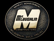 KL07106 NOS 1981  McLAUGHLIN CONSTRUCTORS - GOLD PROJECT  SOLID BRASS BUCKLE