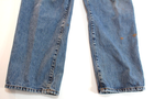 Blue VTG Lucky Brand jeans with 34x30 medium wash, front seam detailing, and brown paint splatter on left leg.