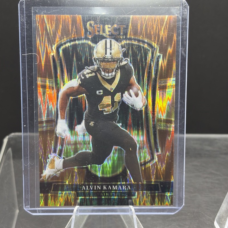 Alvin Kamara, 2025 Select - Premier Copper Shock Prizm /899. New Orleans Saints.