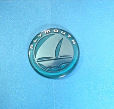 Plymouth Neon / Voyager teal and silver ship logo hood emblem