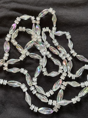 The product is a vintage 1986 Avon Rainbow Reflections necklace. 