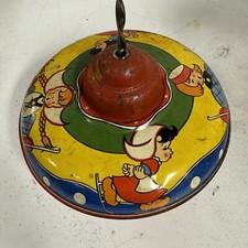 Pump Tin Spinning Top Toy Dutch Boy Girl Skaters Lithograph c1950s Vtg BH