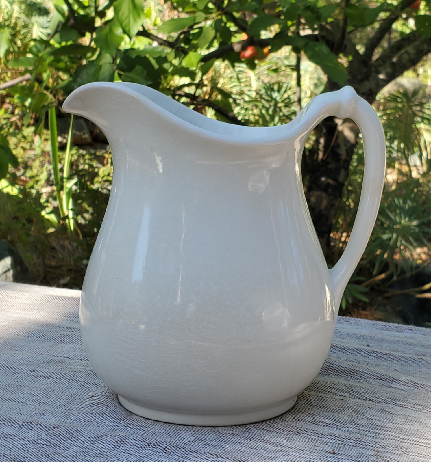 Large white ironstone farmhouse water pitcher.