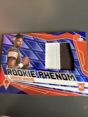 2025 Panini Phoenix - Rookie Phenom Jersey Shedeur Sanders #PJY-SSS Blue /199...