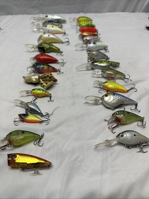 26 Artificial Fishing Lures In Various Sizes And Colors.