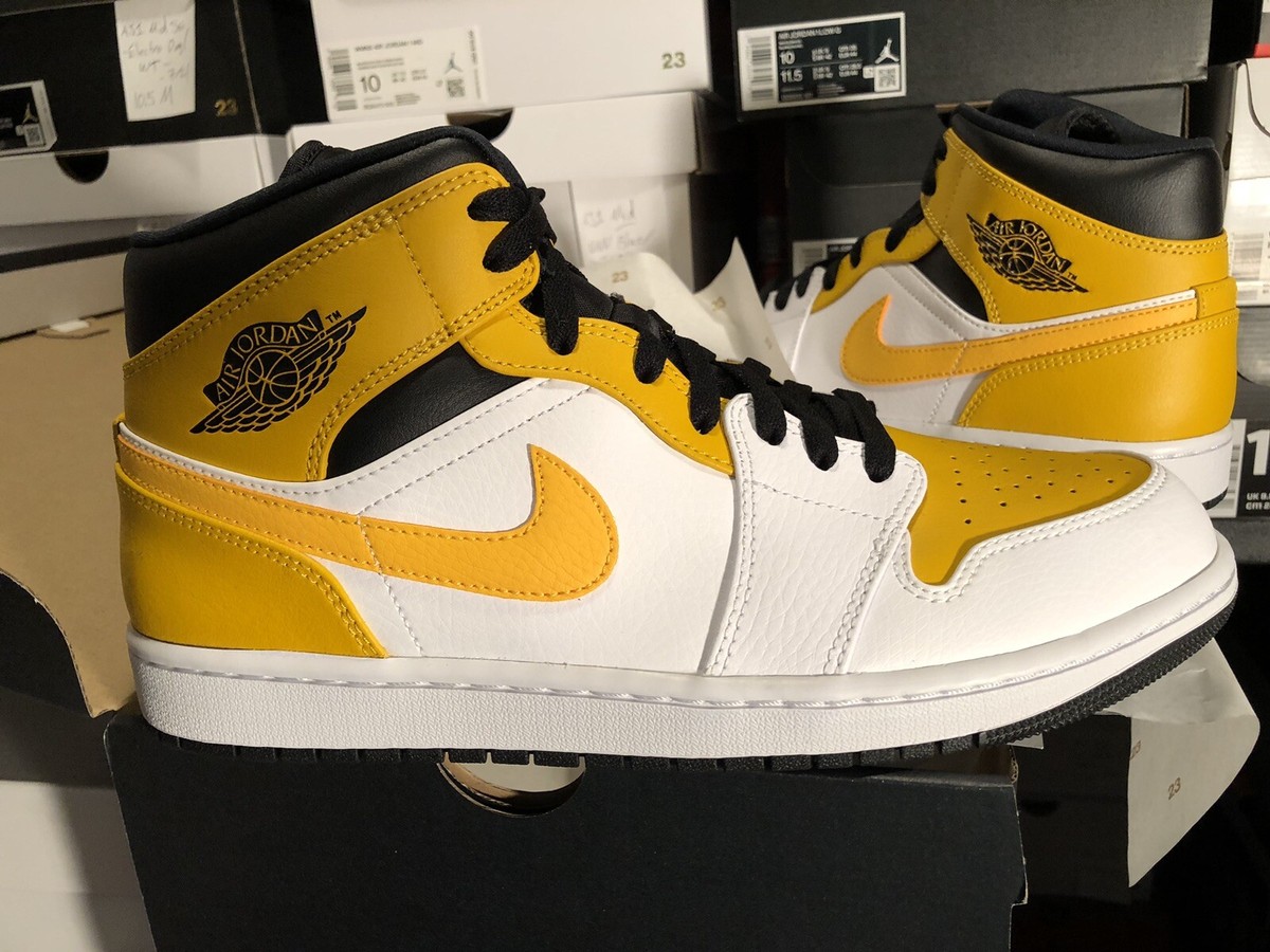 air jordan 1 mid university gold on feet