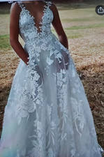 White V Neck Sleeveless Lace Embroidered A-Line Wedding Dress with Train