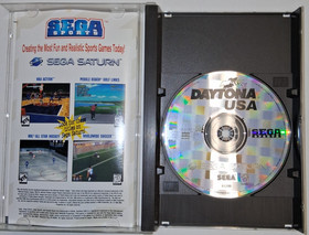 Daytona USA (Sega Saturn, 1995) includes game disc, case, and manual