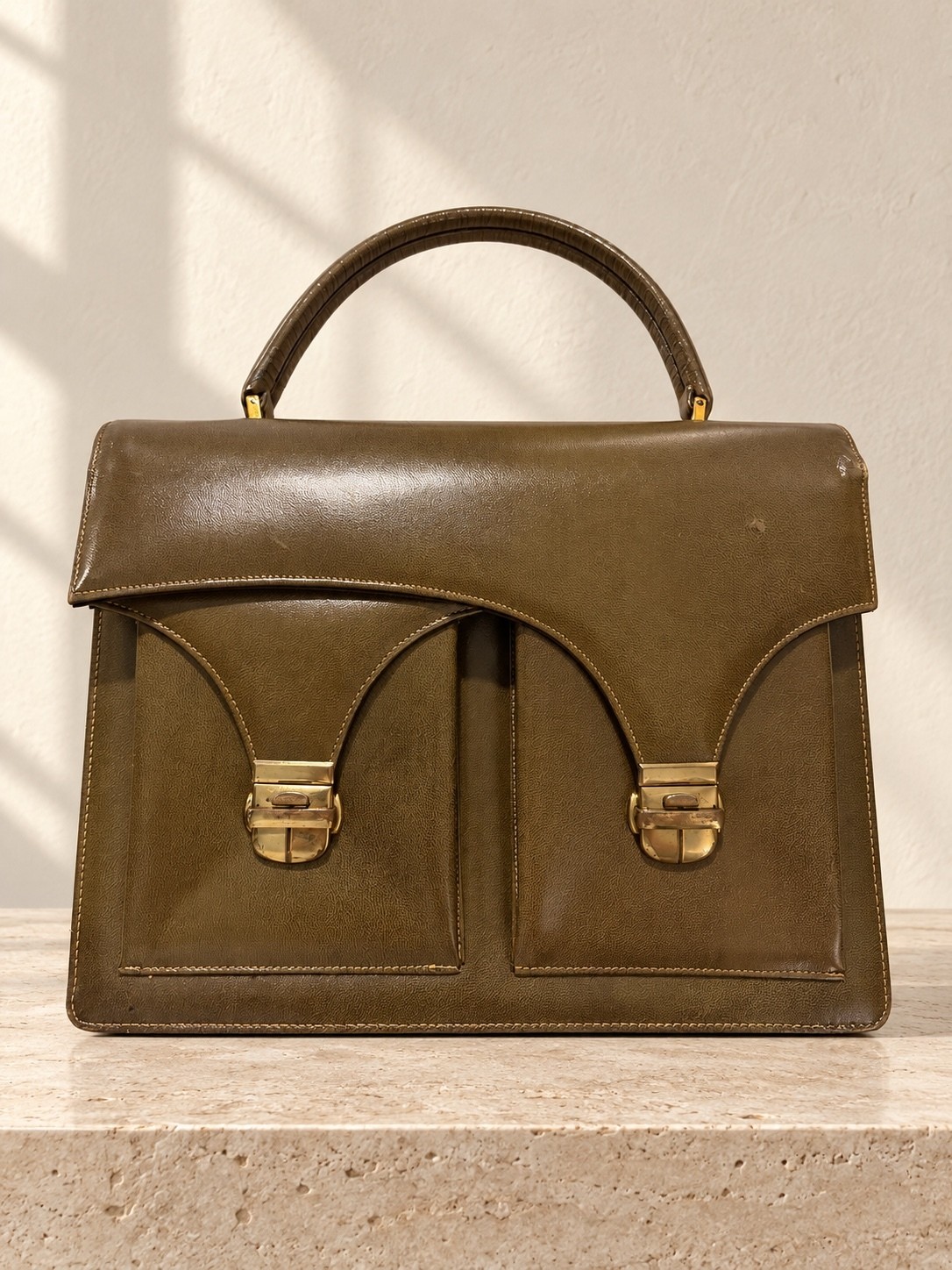 Olive green structured leather top-handle handbag by Dofan France