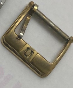 omega belt buckle
