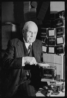 Photo:Tea Merchant 1910s Man Scooping Hu-Kwa Tea Tin Display